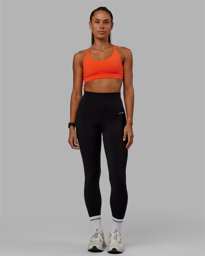 Woman wearing Rapid Sports Bra - Ultra Orange