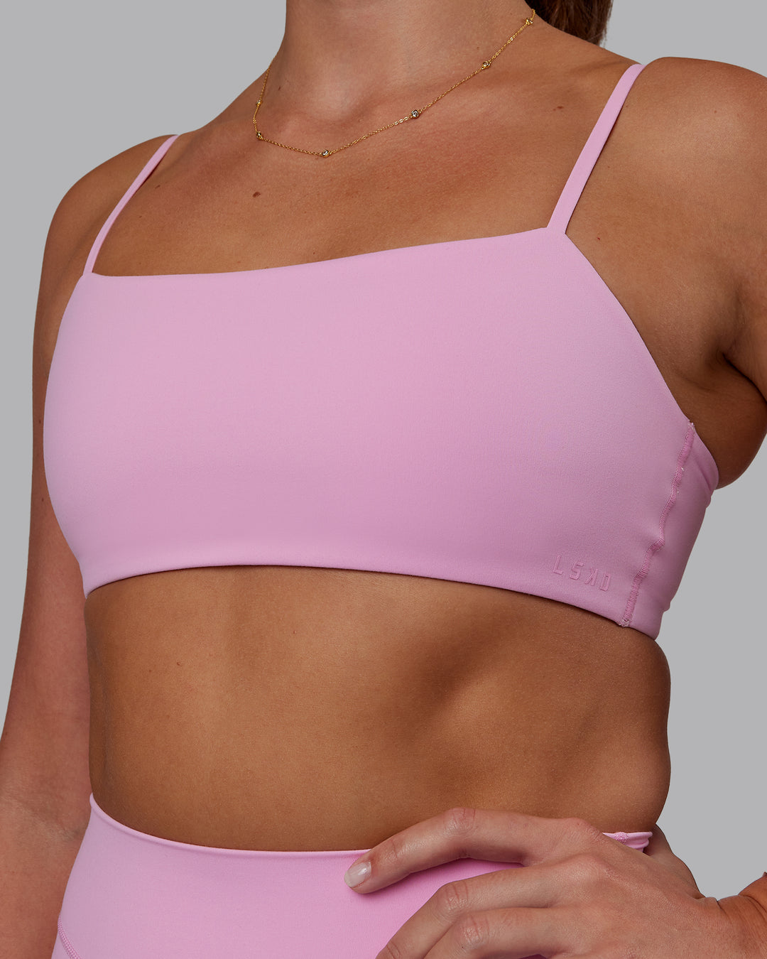 Woman wearing Rebel Heart Sports Bra - Pink Frosting | Model:Phoebe | Size:S