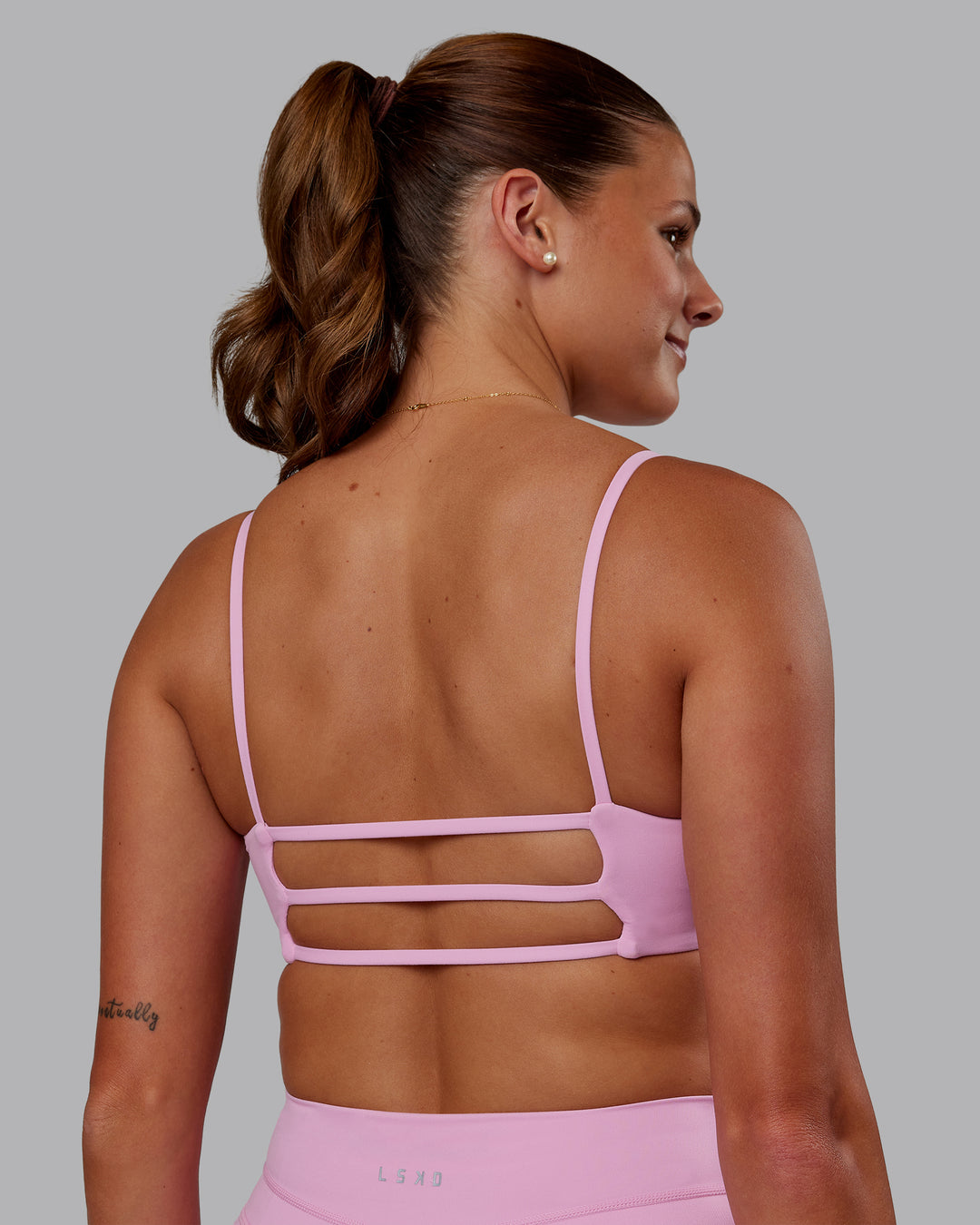 Woman wearing Rebel Heart Sports Bra - Pink Frosting | Model:Phoebe | Size:S