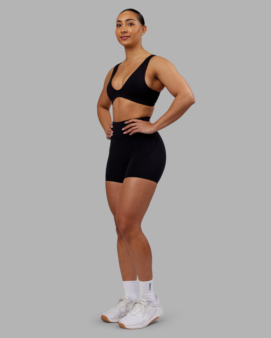 Woman wearing Reform Sports Bra - Black | Model:Ayla | Size:S