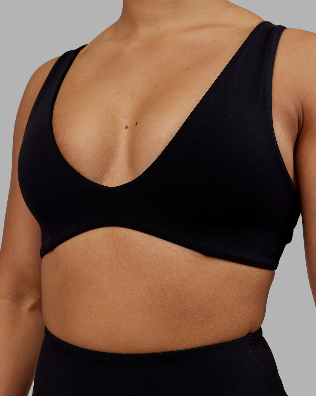 Woman wearing Reform Sports Bra - Black | Model:Ayla | Size:S