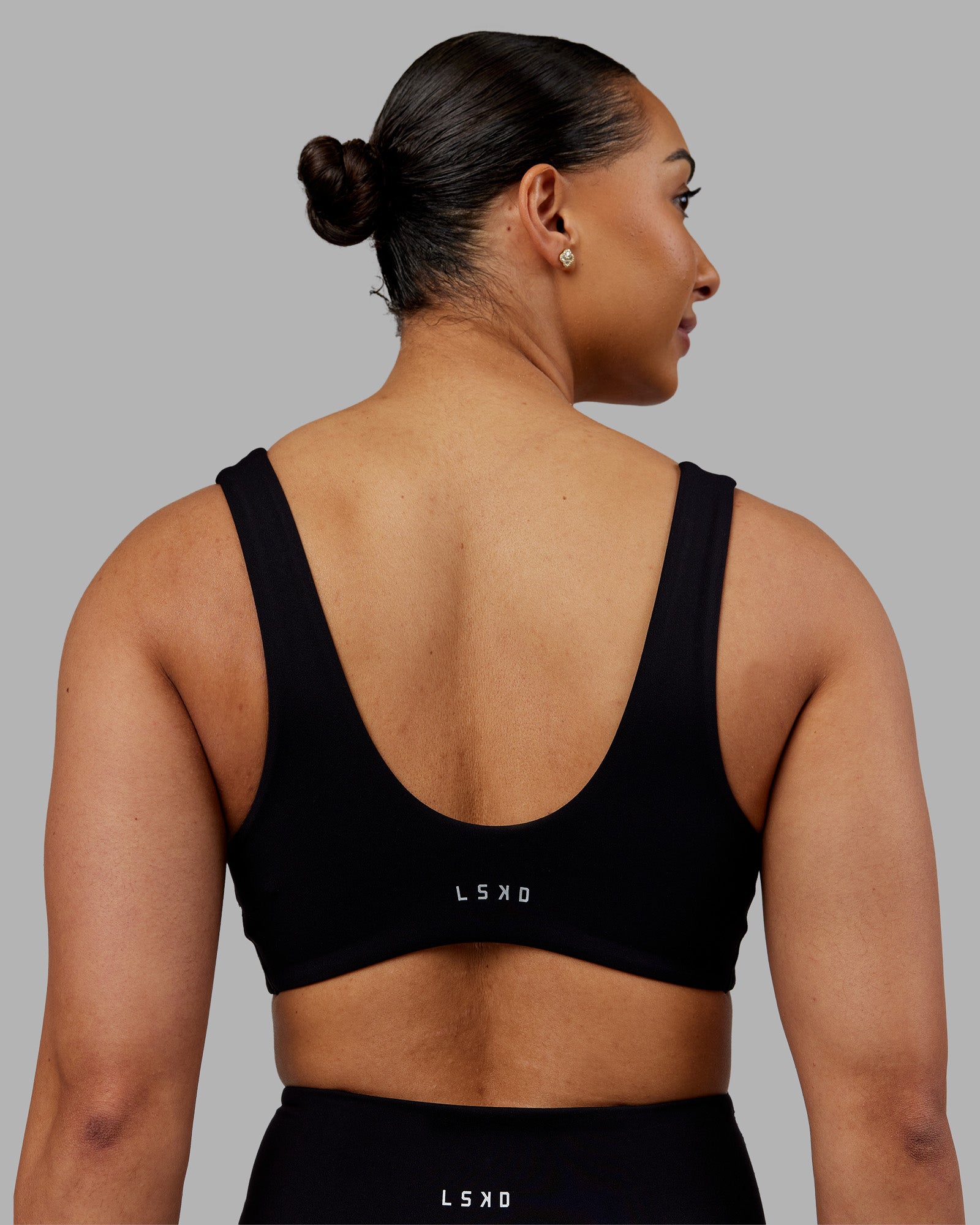 Woman wearing Reform Sports Bra - Black | Model:Ayla | Size:S