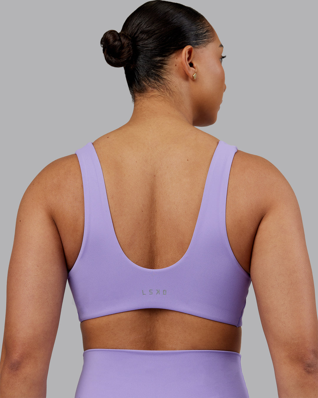 Woman wearing Reform Sports Bra - Violet Ray | Model:Ayla | Size:S