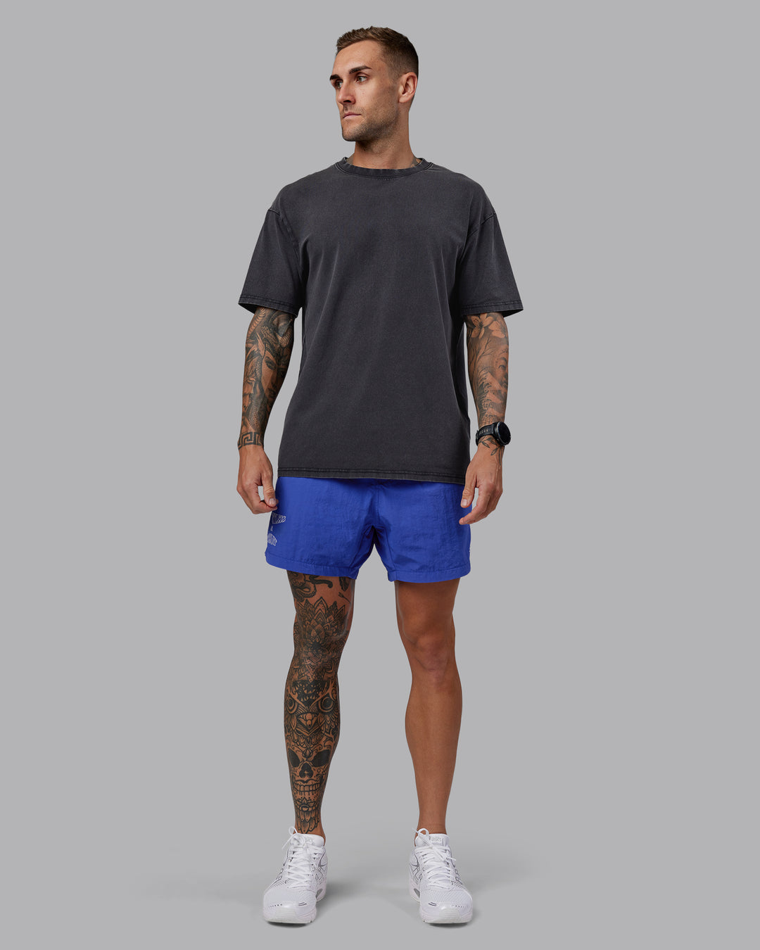 Man wearing Relentless Washed FLXCotton Oversized Tee - Black-Ultimate Grey | Model:Tommy | Size:S
