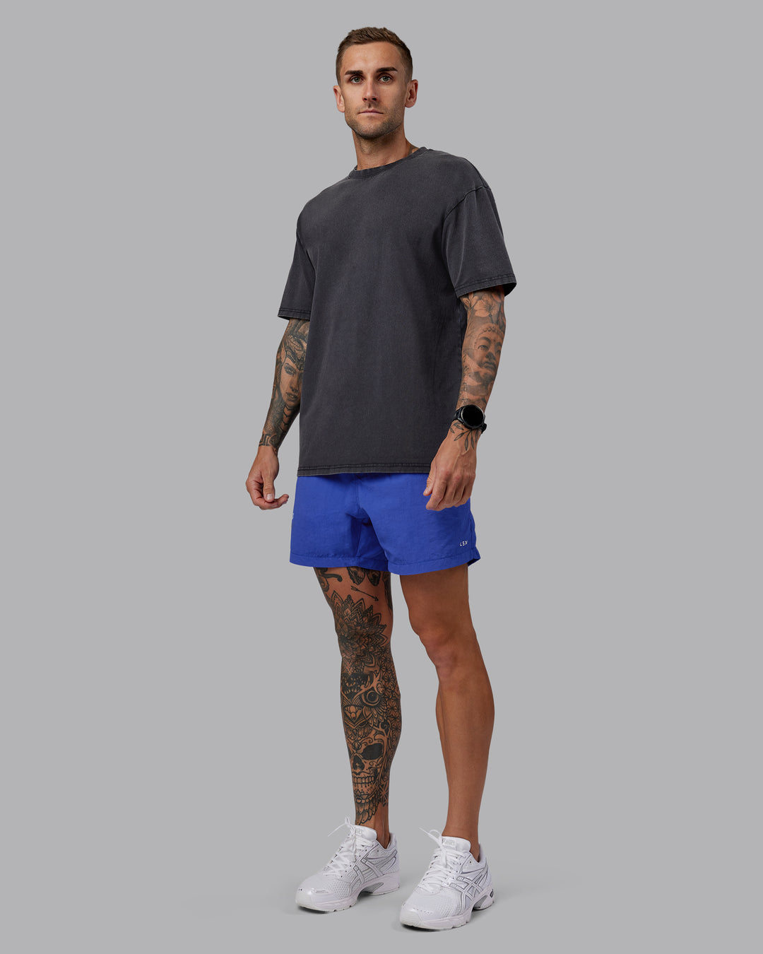 Man wearing Relentless Washed FLXCotton Oversized Tee - Black-Ultimate Grey | Model:Tommy | Size:S