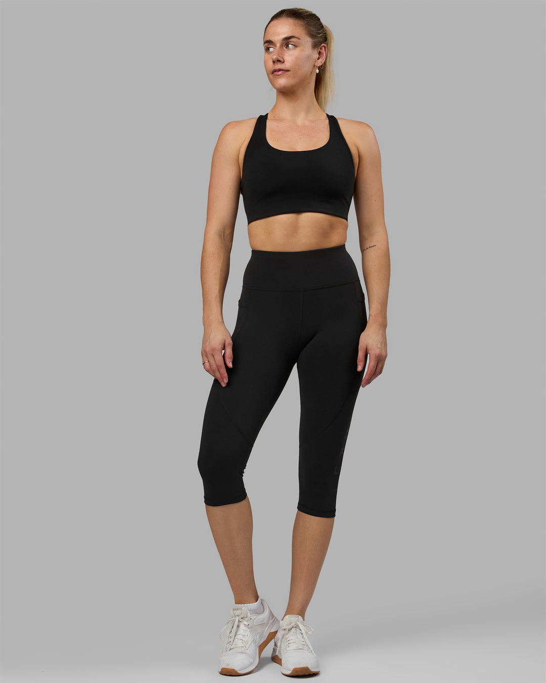 Woman wearing Rep Ultra High-Rise 3/4 Legging Pockets - Black-Black | Model:Hannah | Size:S