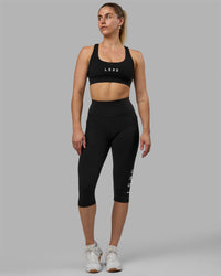Woman wearing Rep Ultra High-Rise 3/4 Legging Pockets - Black-White | Model:Hannah | Size:S