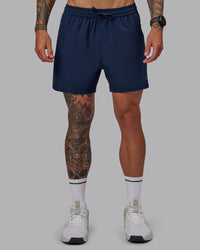 Man wearing Rep 5'' Performance Short in Future Navy | Size:S