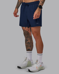 Man wearing Rep 5'' Performance Short in Future Navy | Size:S