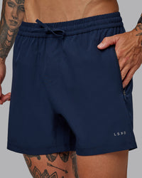 Man wearing Rep 5'' Performance Short in Future Navy | Size:S