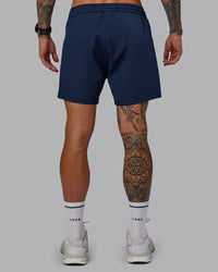 Man wearing Rep 5'' Performance Short in Future Navy | Size:S