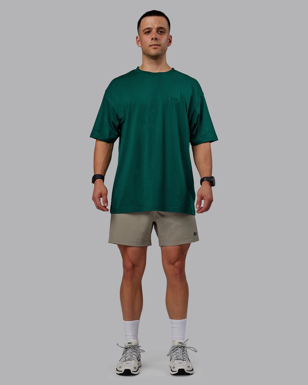 Man wearing Rep 5" Performance Shorts - Elephant
