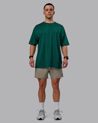 Man wearing Rep 5" Performance Shorts - Elephant