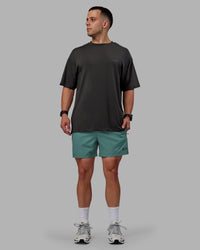 Man wearing Rep 5" Performance Shorts - Sage Bush