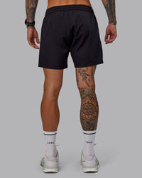 Man wearing Rep 5'' Performance Short in Black | Size:S