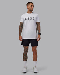 Man wearing Rep 5'' Performance Short in Black | Size:S