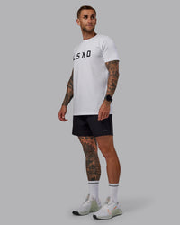 Man wearing Rep 5'' Performance Short in Black | Size:S