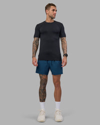 Man wearing Rep 5" Performance Short - Night Sea | Model:Tommy | Size:S