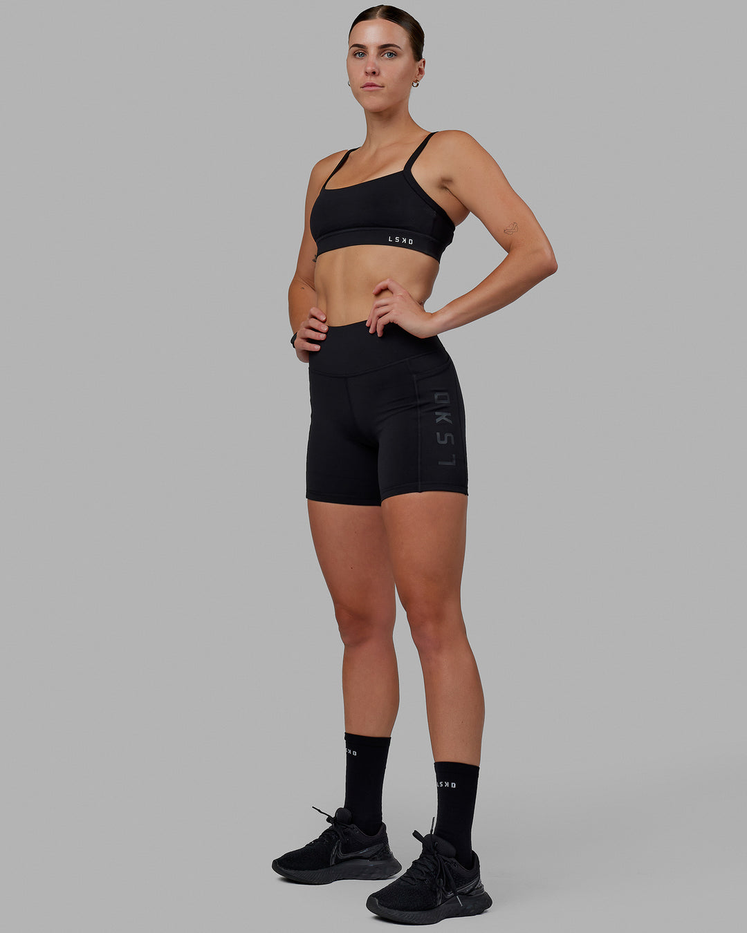 Woman wearing Rep Ultra High-Rise 6&quot; Short Pockets - Black-Black | Model:Shae | Size:S