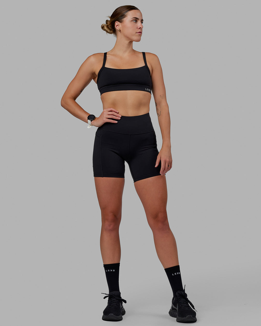 Woman wearing Rep Ultra High-Rise 6&quot; Short Pockets - Black-Black | Model:Shae | Size:S