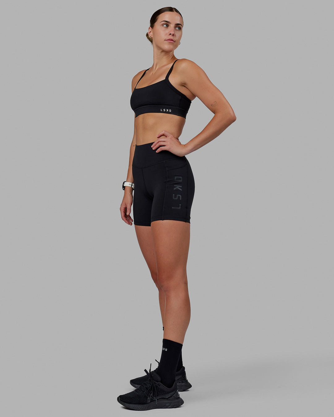 Woman wearing Rep Ultra High-Rise 6&quot; Short Pockets - Black-Black | Model:Shae | Size:S