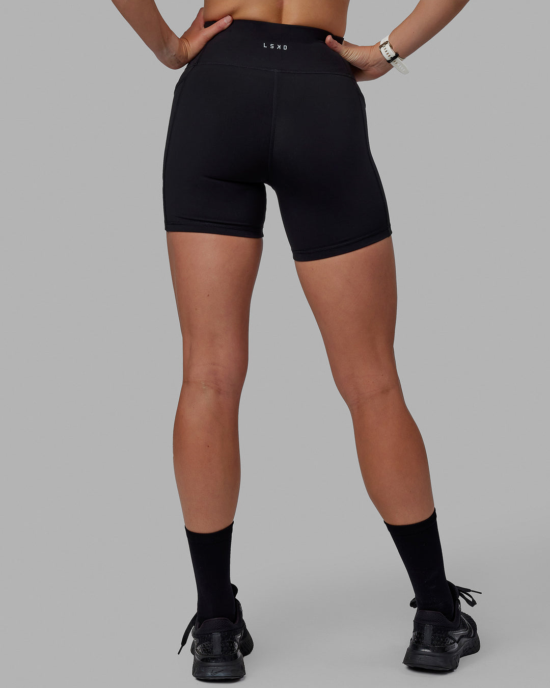 Woman wearing Rep Ultra High-Rise 6&quot; Short Pockets - Black-Black | Model:Shae | Size:S