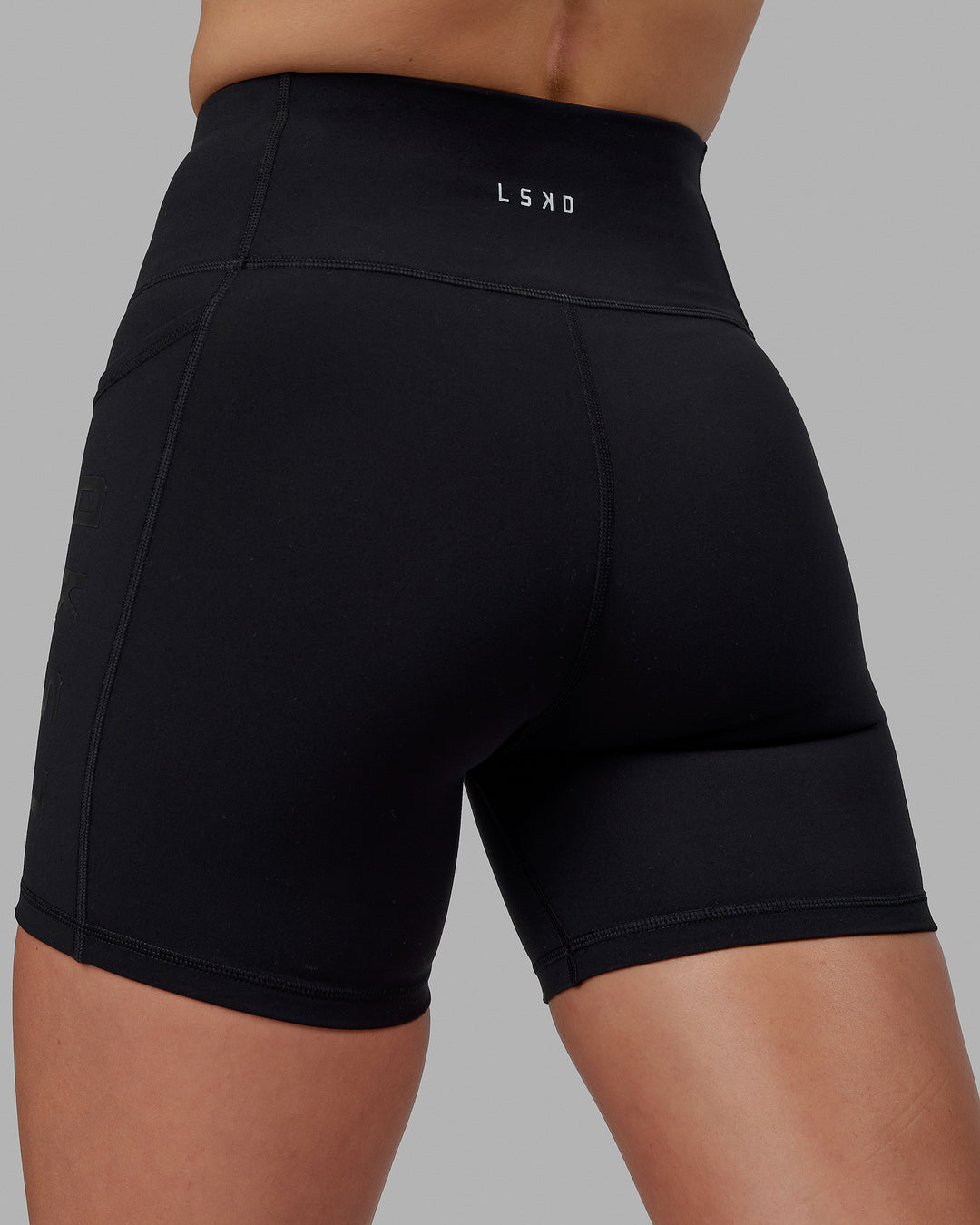 Woman wearing Rep Ultra High-Rise 6&quot; Short Pockets - Black-Black | Model:Shae | Size:S