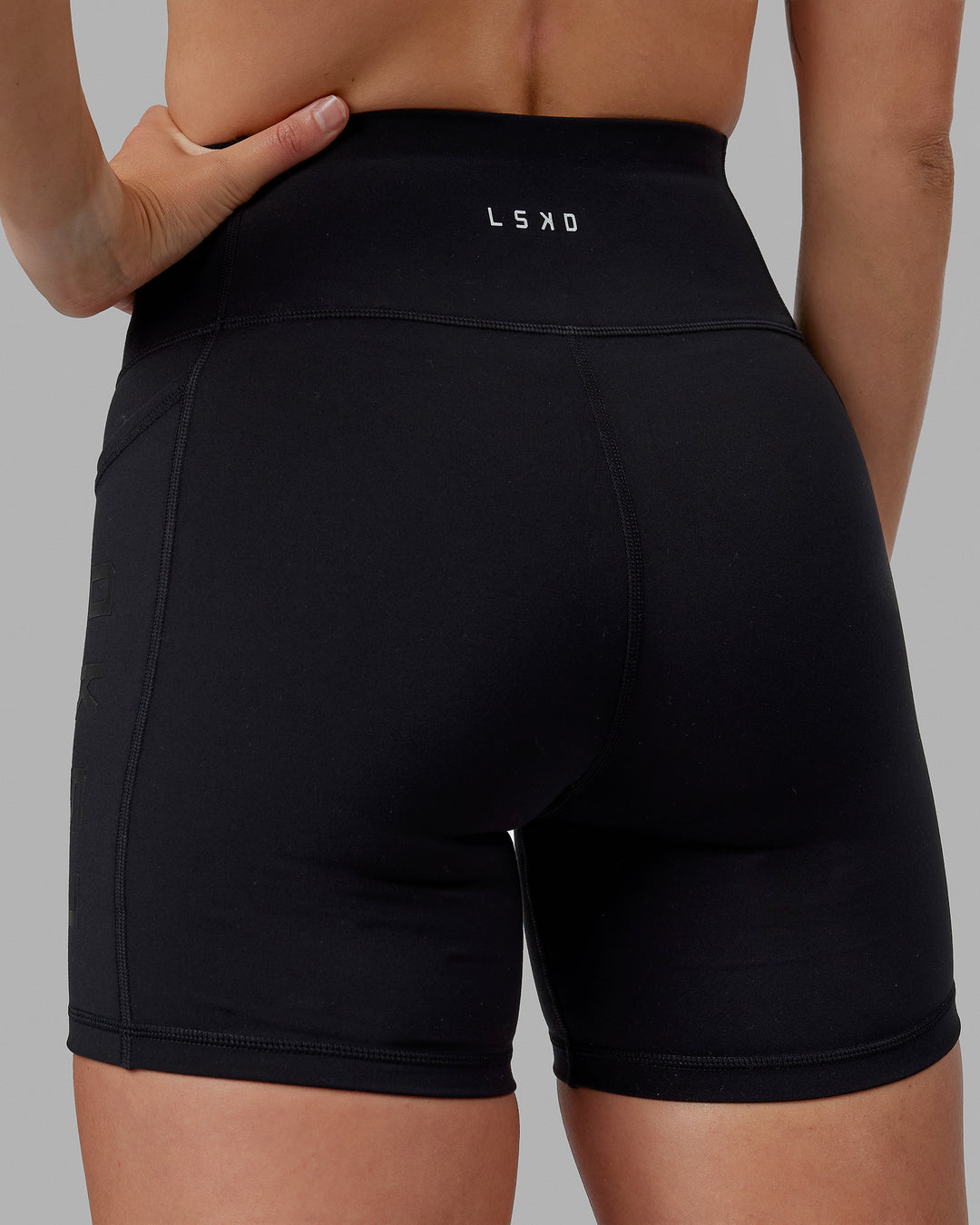Woman wearing Rep Ultra High-Rise 6&quot; Short Pockets - Black-Black | Model:Shae | Size:S