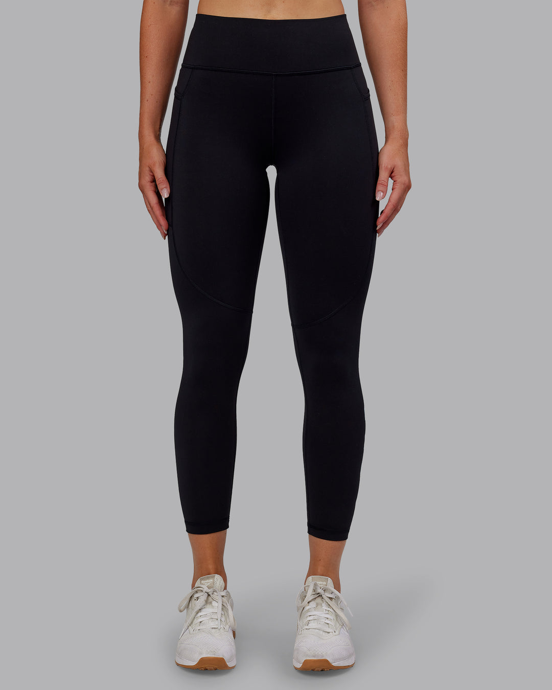 Woman wearing Rep Ultra High-Rise 7/8 Legging Pockets - Black-Retro Blue | Model:Paris | Size:S