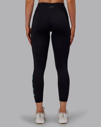 Woman wearing Rep Ultra High-Rise 7/8 Legging Pockets - Black-Retro Blue | Model:Paris | Size:S