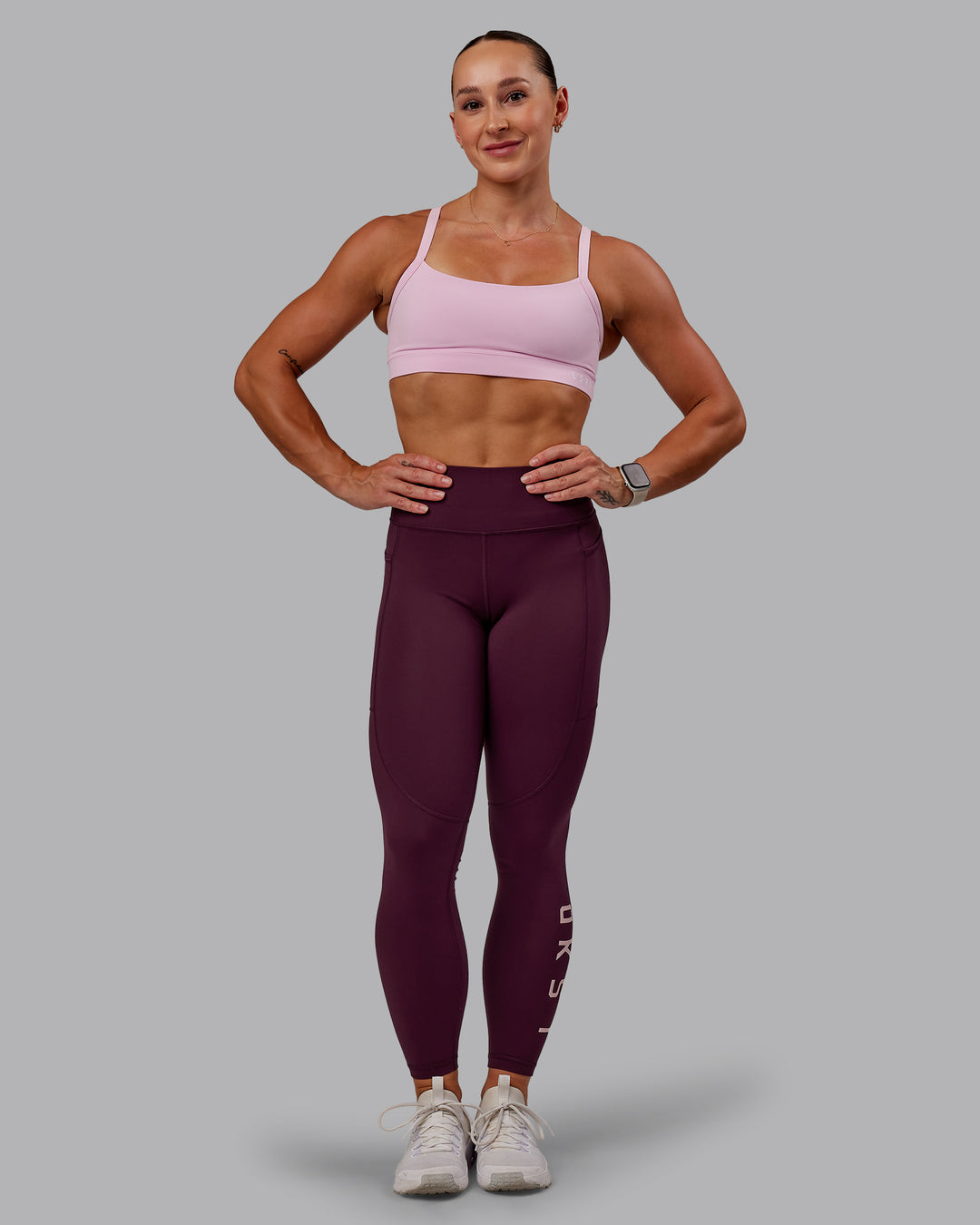 Woman wearing Rep Ultra High-Rise 7/8 Legging Pockets - Cherry Lacquer-Marshmallow | Model:Amber | Size:S