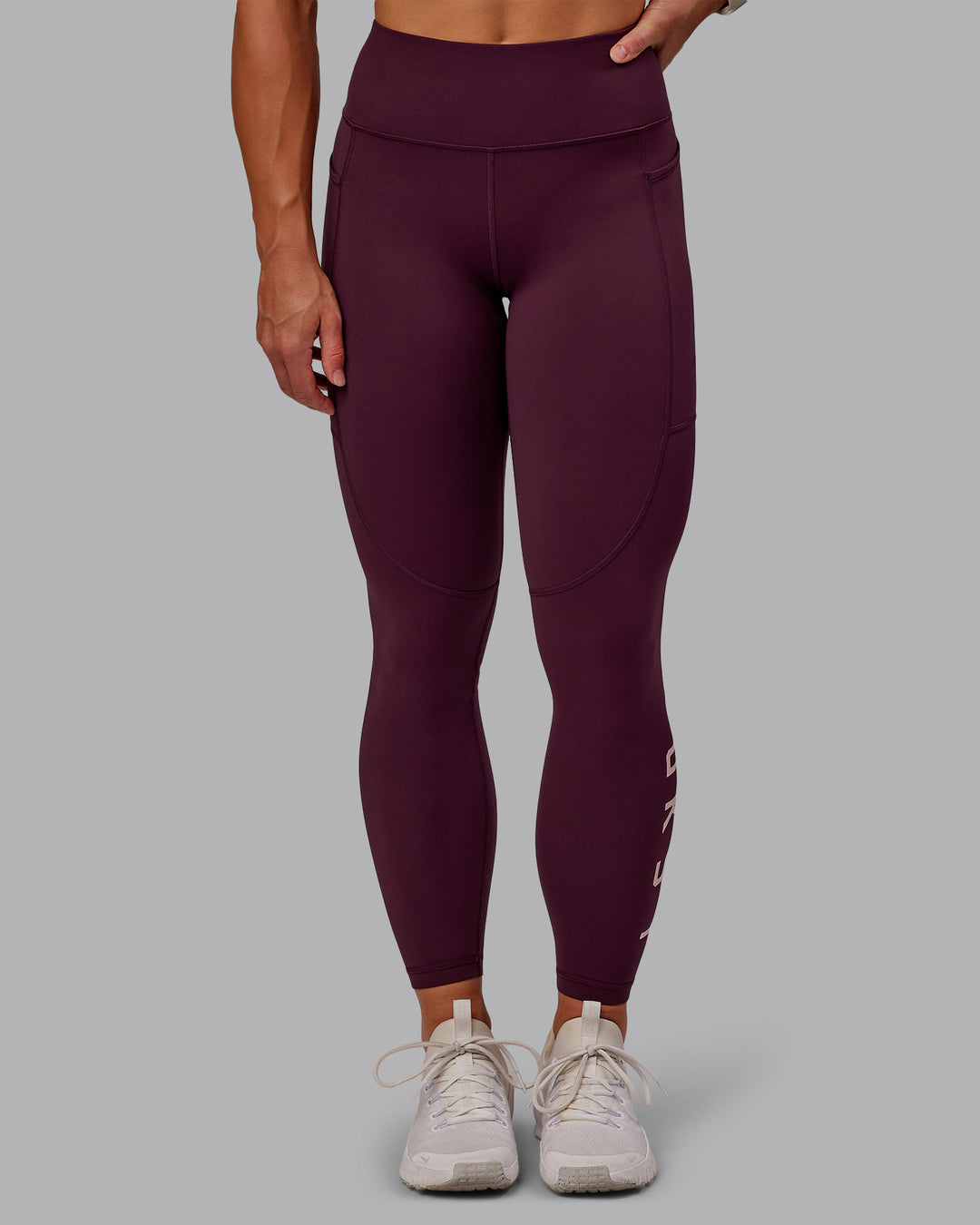 Woman wearing Rep Ultra High-Rise 7/8 Legging Pockets - Cherry Lacquer-Marshmallow | Model:Amber | Size:S