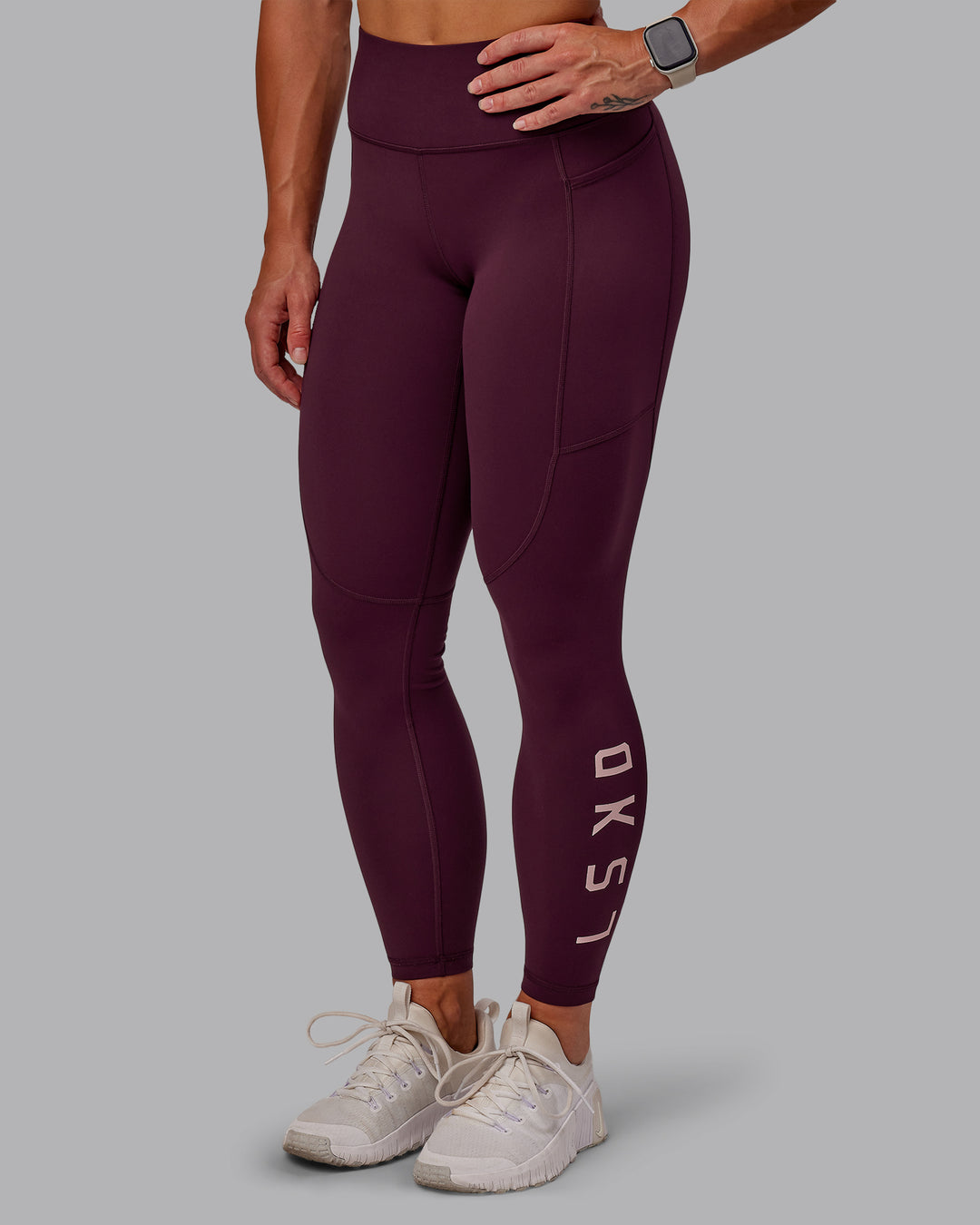 Woman wearing Rep Ultra High-Rise 7/8 Legging Pockets - Cherry Lacquer-Marshmallow | Model:Amber | Size:S