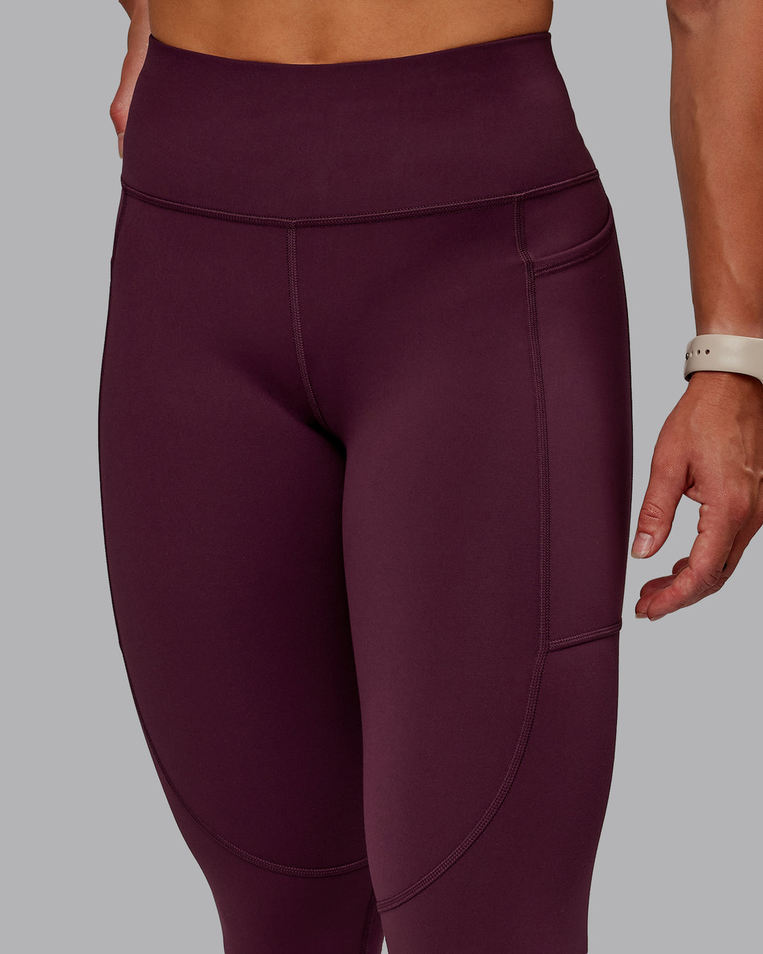 Woman wearing Rep Ultra High-Rise 7/8 Legging Pockets - Cherry Lacquer-Marshmallow | Model:Amber | Size:S