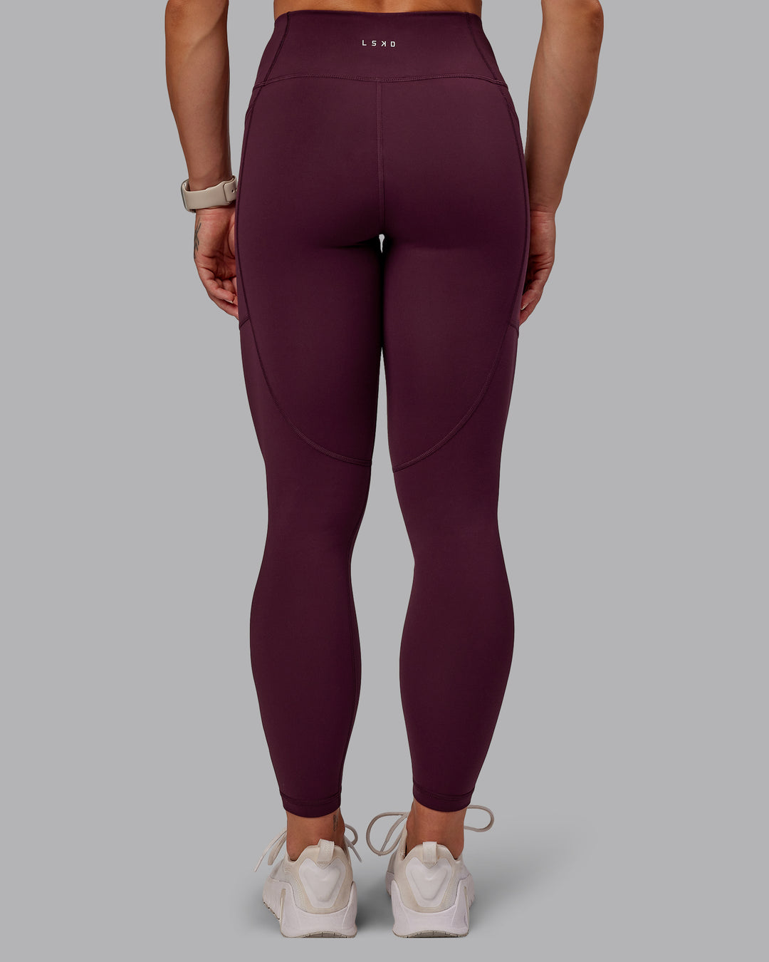 Woman wearing Rep Ultra High-Rise 7/8 Legging Pockets - Cherry Lacquer-Marshmallow | Model:Amber | Size:S