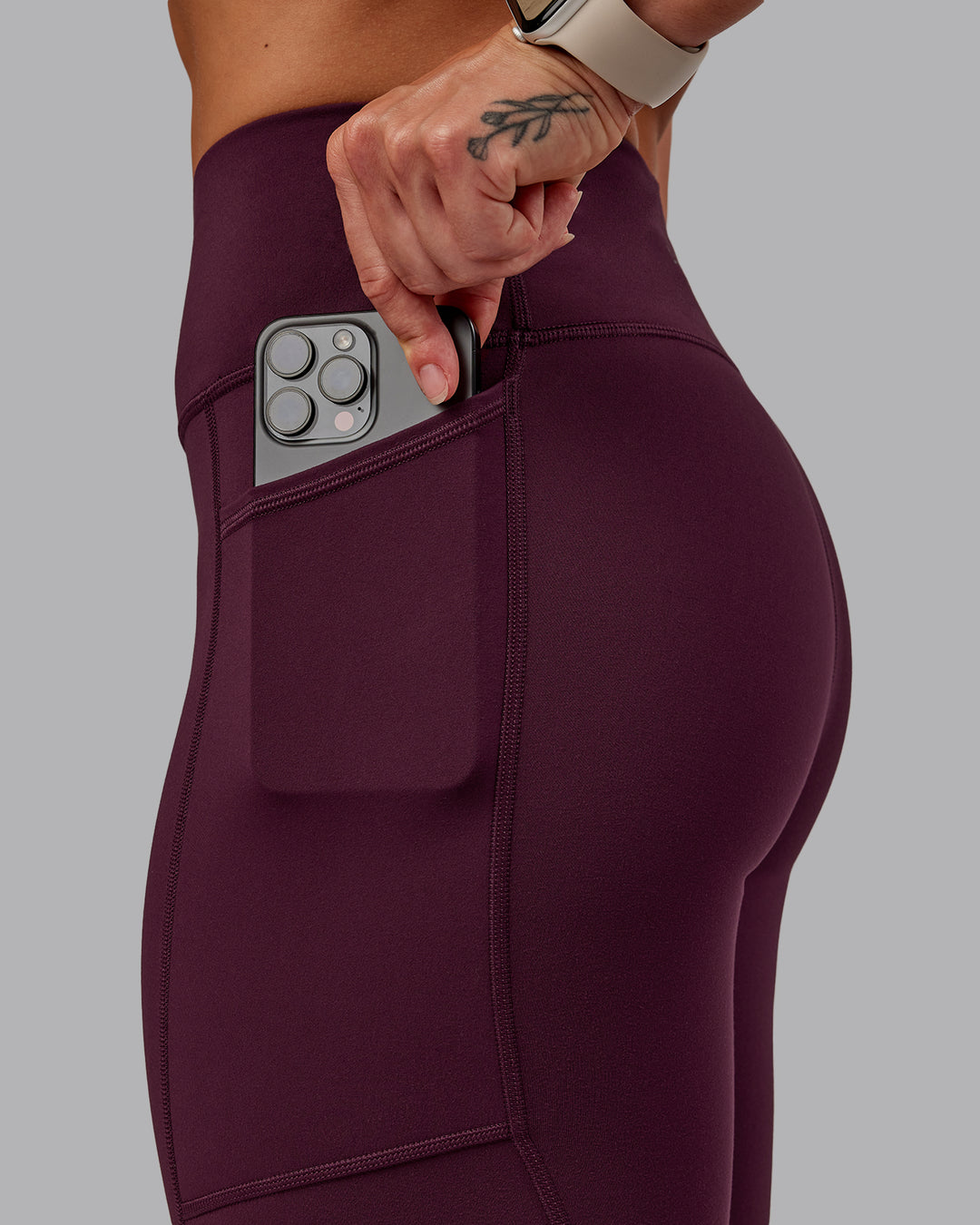 Woman wearing Rep Ultra High-Rise 7/8 Legging Pockets - Cherry Lacquer-Marshmallow | Model:Amber | Size:S