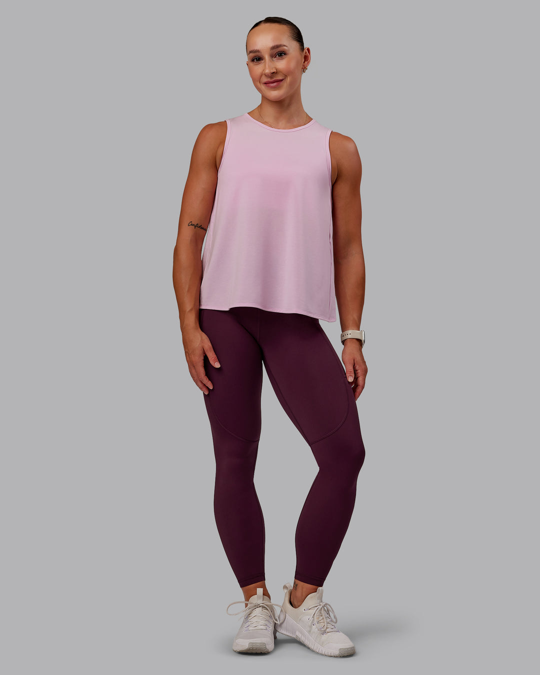 Woman wearing Rep Ultra High-Rise 7/8 Legging Pockets - Cherry Lacquer-Marshmallow | Model:Amber | Size:S