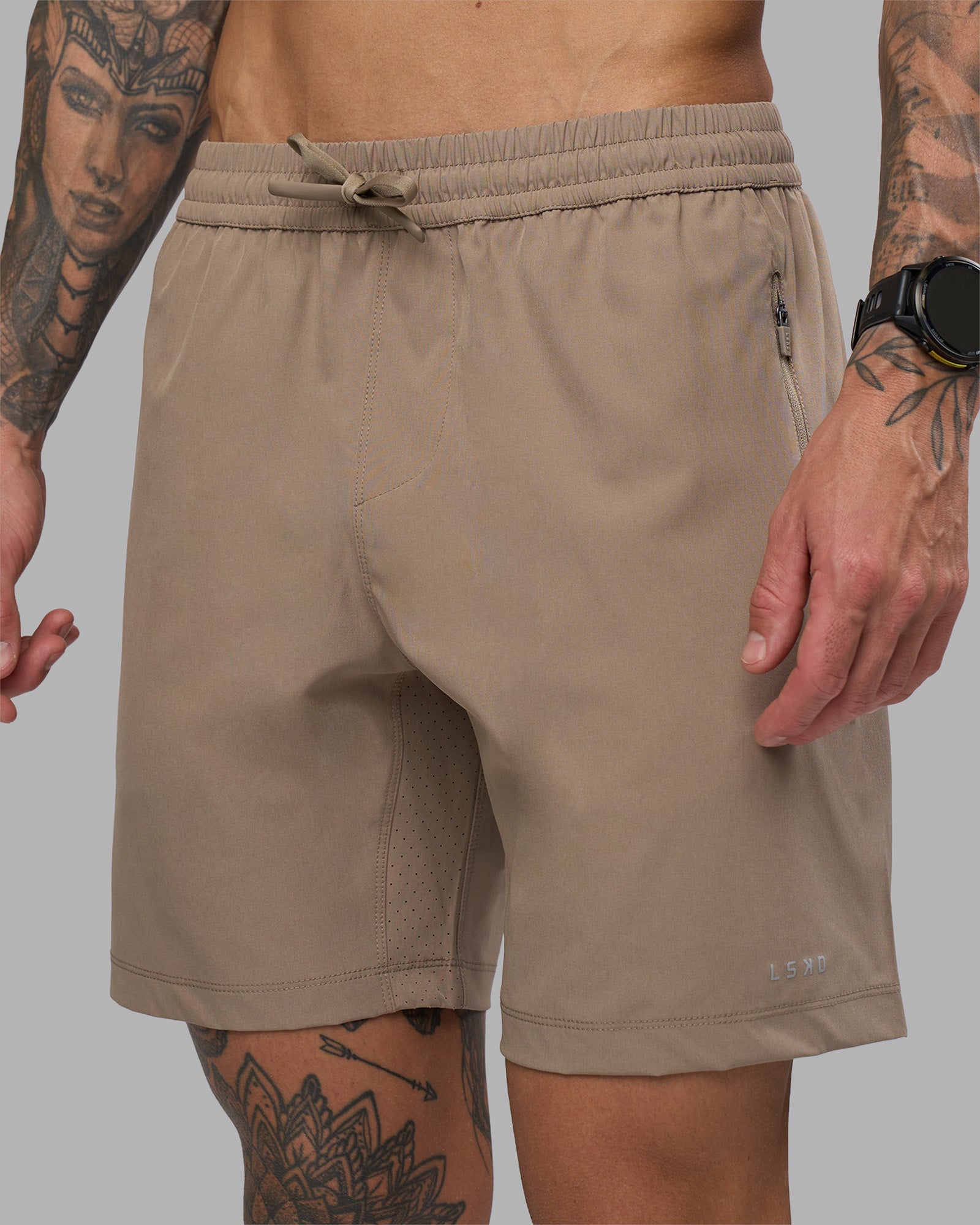 Man wearing Rep 7'' Performance Short - Greige | Model:Tommy | Size:S