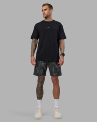 Man wearing Rep 7'' Performance Short - Lunar Glow Print | Model:Tommy | Size:S