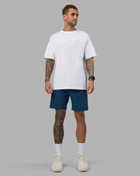 Man wearing Rep 7'' Performance Short - Night Sea | Model:Tommy | Size:S