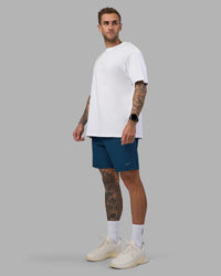 Man wearing Rep 7'' Performance Short - Night Sea | Model:Tommy | Size:S