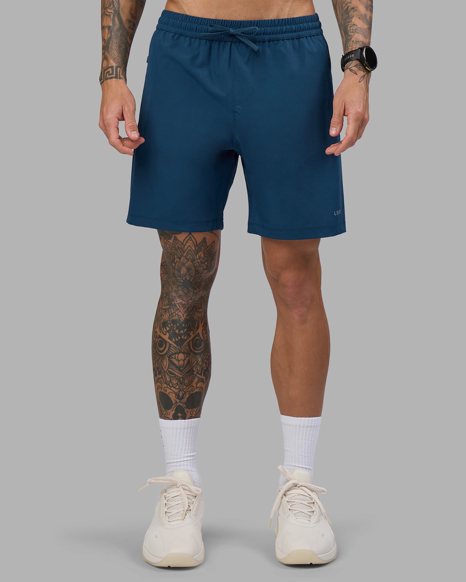 Man wearing Rep 7'' Performance Short - Night Sea | Model:Tommy | Size:S