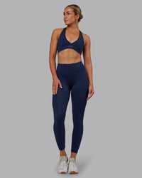 Woman wearing Rep Ultra High-Rise 7/8 Legging Pockets No Logo - Future Navy | Model:Paris | SIze:S