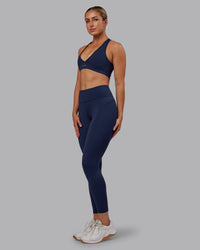 Woman wearing Rep Ultra High-Rise 7/8 Legging Pockets No Logo - Future Navy | Model:Paris | SIze:S