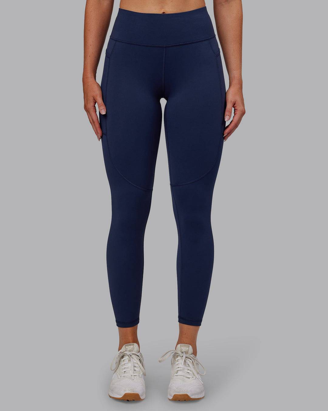 Woman wearing Rep Ultra High-Rise 7/8 Legging Pockets No Logo - Future Navy | Model:Paris | SIze:S