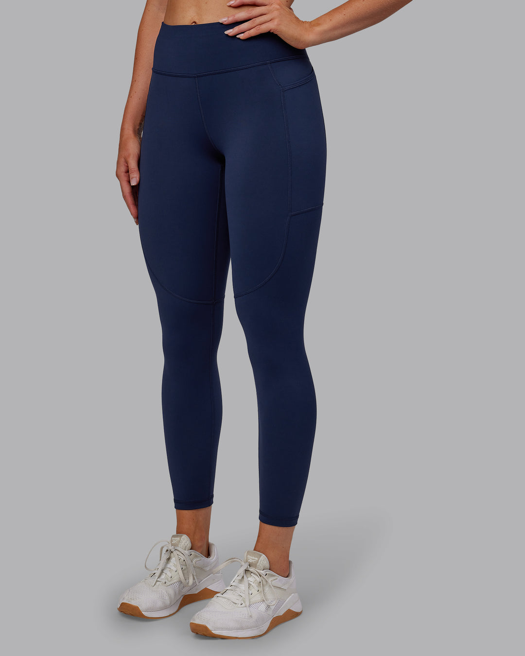 Woman wearing Rep Ultra High-Rise 7/8 Legging Pockets No Logo - Future Navy | Model:Paris | SIze:S