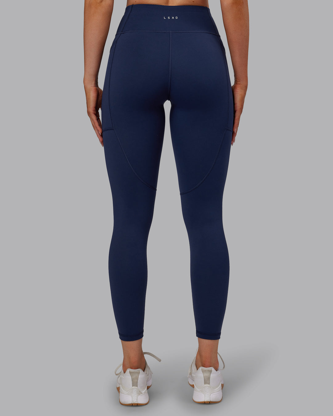 Woman wearing Rep Ultra High-Rise 7/8 Legging Pockets No Logo - Future Navy | Model:Paris | SIze:S