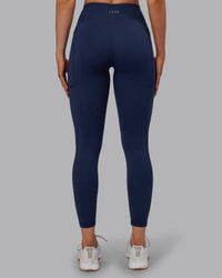 Woman wearing Rep Ultra High-Rise 7/8 Legging Pockets No Logo - Future Navy | Model:Paris | SIze:S