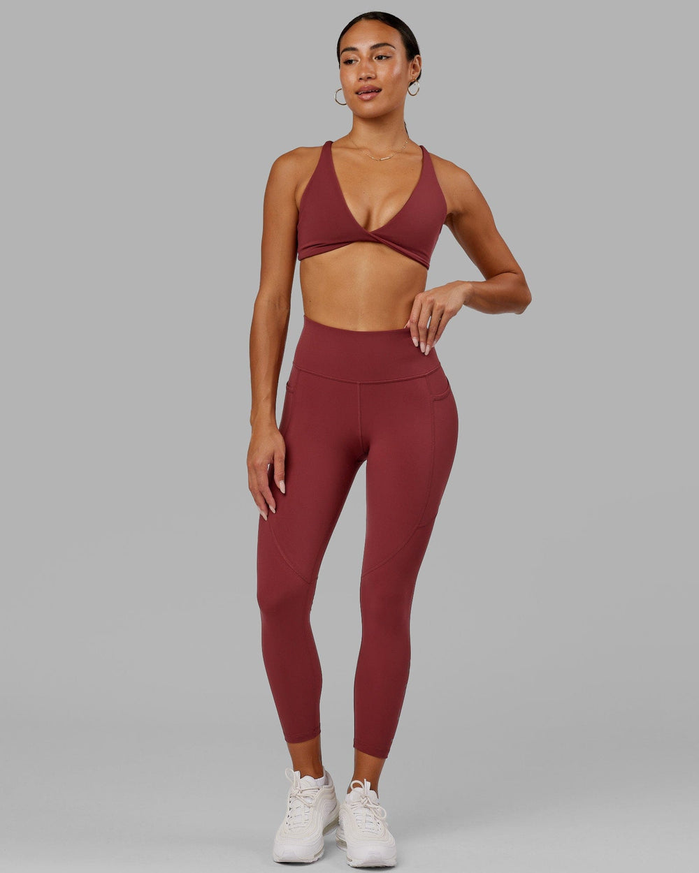Woman wearing Rep 7/8 Length Tight - Apple Berry