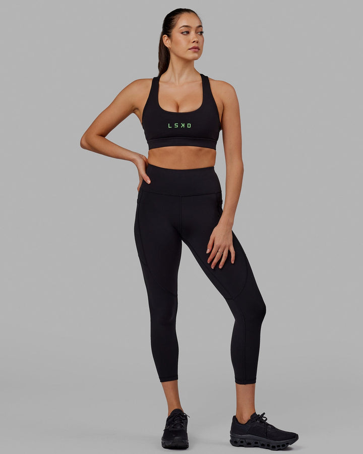 Woman wearing Rep 7/8 Length Tight - Black-Apple Mint